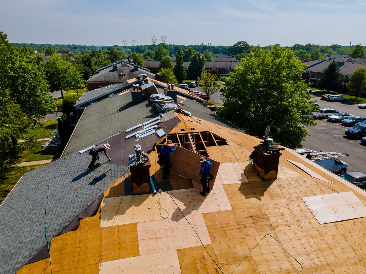 New roofing shingles being installed on a building